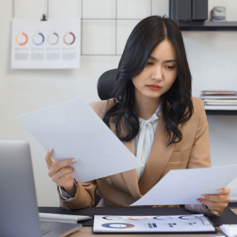 Expert translator reviewing translated document through certified translation services in New York to ensure accuracy.