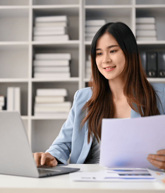 Translator working on official documents using certified translation services in New York with competitive pricing.